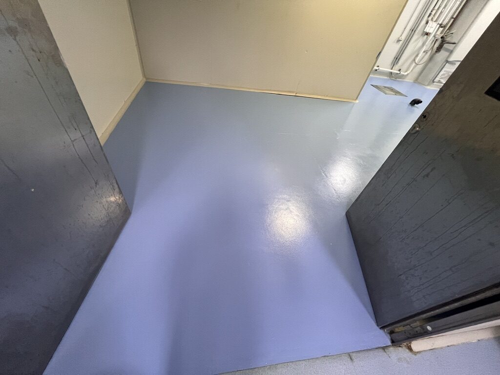 Blue commercial epoxy floor completed for a NSW chemical-mixing area