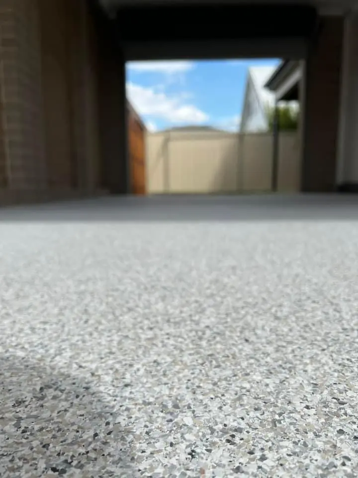 Light grey decorative flake garage floor surface detail