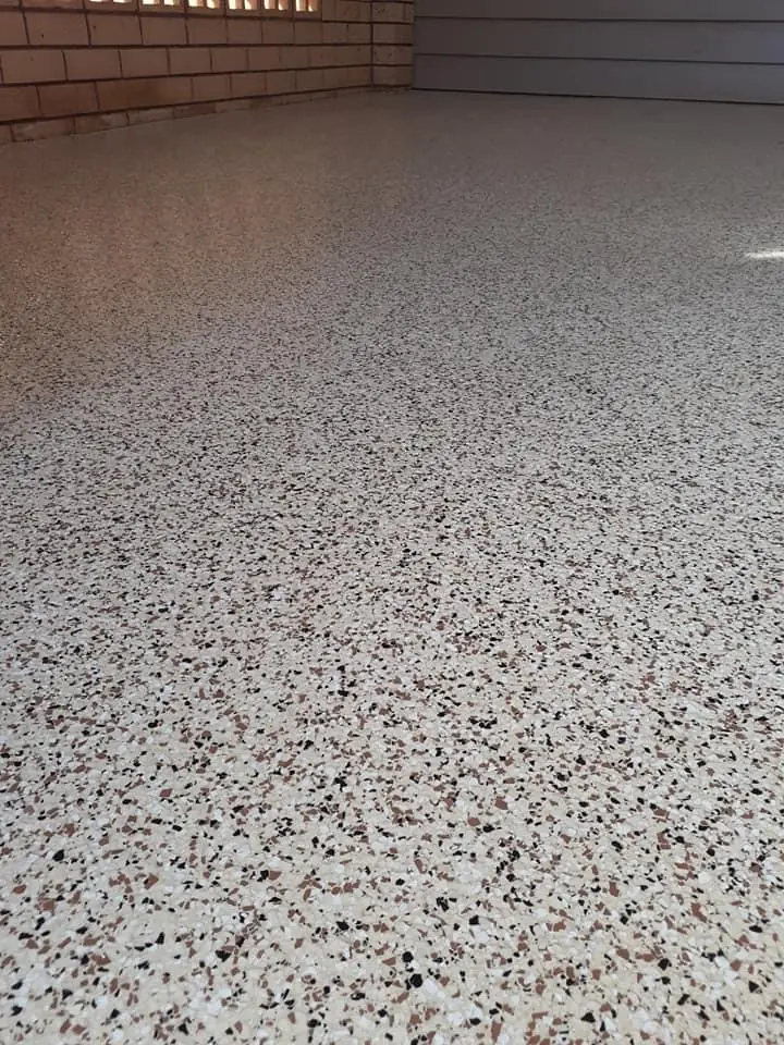 Neutral beige and grey decorative flake garage floor