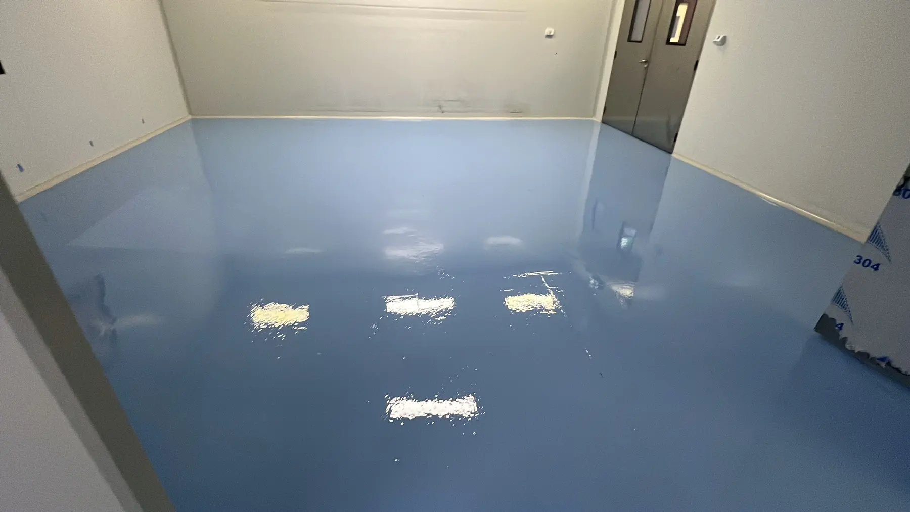 Finished blue resin floor in a confidential pharmaceutical production area