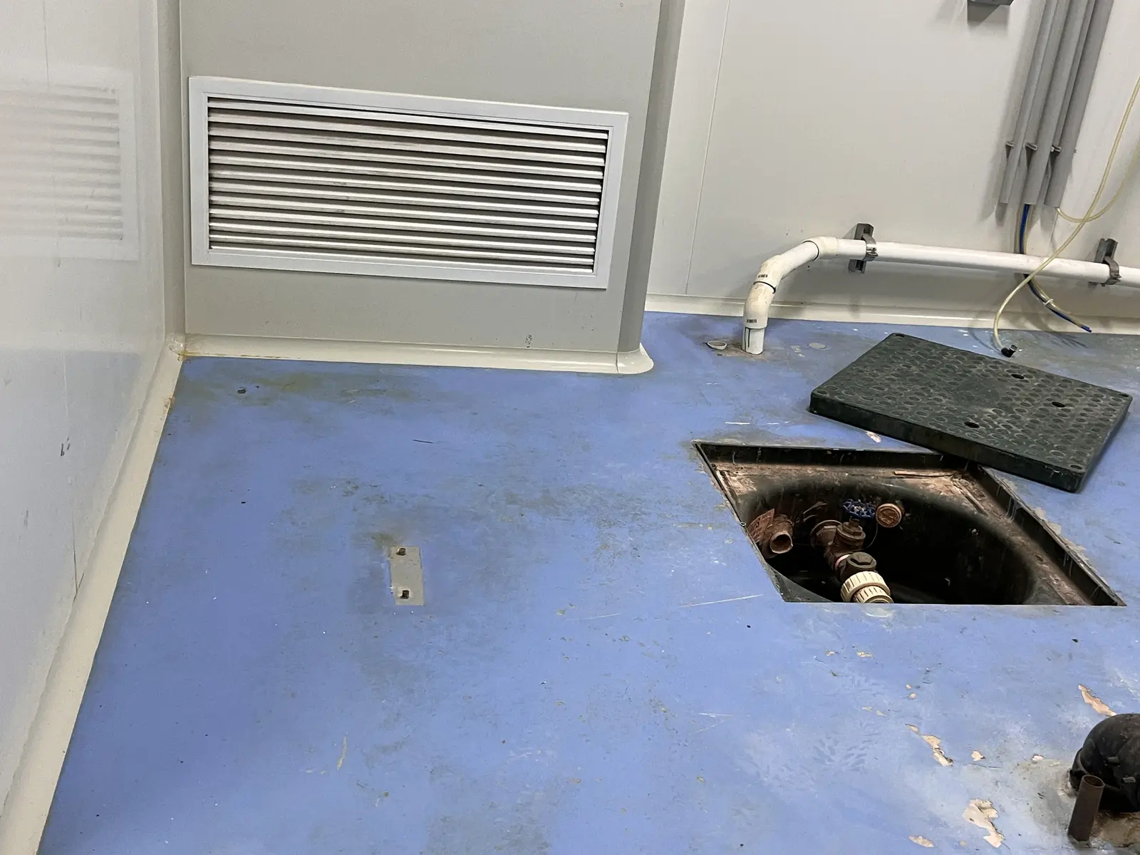 Open floor trench and drain area before coating preparation